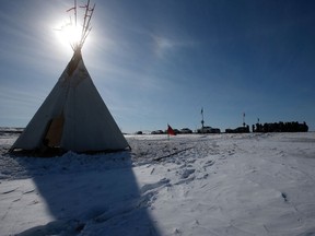 A teepee is shown as Christopher Traverse, Chief of Lake St. Martin First Nation speaks to the media at Winnipeg's Brady Landfill just outside the city, Thursday, April 6, 2023.