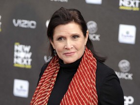 This April 7, 2011 file photo, shows Carrie Fisher at the 2011 NewNowNext Awards in Los Angeles.