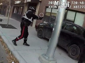 A still image from a body-worn camera shows a bullet casing being ejected from a Calgary police officer's service weapon as it's discharged during a police shooting incident on 8th Avenue S.W. in downtown Calgary on Oct. 19, 2019.