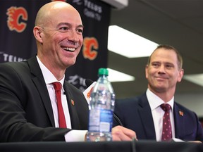 New Calgary Flames head coach Ryan Huska, left, and general manager Craig Conroy speak with media at the Scotiabank Saddledome in Calgary on Monday, June 12, 2023.
