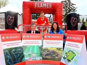 Front L-R, Jeff McCaig, Chairman Calgary Flames Foundation and Sheila Taylor, CEO Parks Foundation Calgary along with Flames player Mikael Backlund as the Calgary Flames Foundation announced a donation to five recreational spaces in Calgary in partnership with Parks Foundation Calgary on Thursday, May 11, 2023.