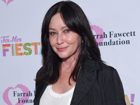 In this file photo Actress Shannen Doherty walks the carpet at the Farrah Fawcett Foundation's "Tex-Mex Fiesta" honouring Marcia Cross at Wallis Annenberg Center for the Performing Arts in Beverly Hills, Calif., on Sept. 6, 2019.