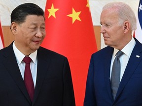 In this file photo taken on Nov. 14, 2022, U.S. President Joe Biden (right) and China's President Xi Jinping meet on the sidelines of the G20 Summit in Nusa Dua on the Indonesian resort island of Bali.