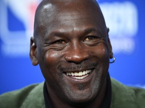 In this file photo taken on January 24, 2020 former NBA star and owner of Charlotte Hornets team Michael Jordan looks on as he addresses a press conference ahead of the NBA basketball match between Milwaukee Bucks and Charlotte Hornets at The AccorHotels Arena in Paris.