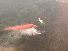 Airtankers work on a wildfire near Edson in a Friday, June 9, 2023, handout photo. The town in northwestern Alberta was evacuated due to an out-of-control wildfire. An evacuation order has been issued for the town of Edson and parts of Yellowhead County.