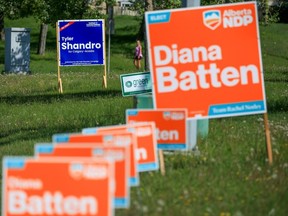 Election signs in Calgary-Acadia, where incumbent UCP candidate Tyler Shandro lost to the NDP's Diana Batten.