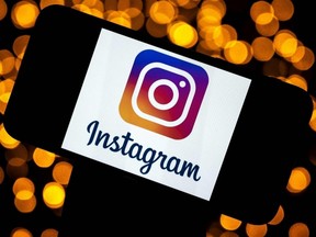 This file photo taken Sept. 29, 2020, shows the Instagram logo on a smartphone, in Toulouse, France.