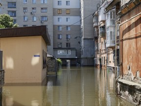 Residential buildings are seen in a flooded area on June 9, 2023 in Kherson, Ukraine.