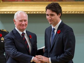 Justin Trudeau shakes hands with then-governor general David Johnston after being sworn in as prime minister of Canada at Rideau Hall in Ottawa on Nov. 4, 2015.