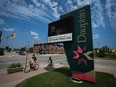 Digital signage with the message "Dauphin Strong" is seen outside city hall in Dauphin, Man., on Saturday, June 17, 2023. Church services are to offer residents of Dauphin, Man., solace today as they mourn 15 community members who died in a highway crash that also left 10 gravely injured.THE CANADIAN PRESS/Darryl Dyck