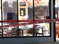 Police tape cordons off a restaurant in Auckland, New Zealand, Tuesday, June 20, 2023, after an axe attack late Monday. Multiple people were hospitalized after a man armed with an axe began attacking diners at random at three neighboring Chinese restaurants, according to police and witnesses.