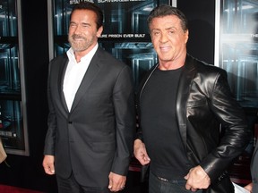 Arnold Schwarzenegger and Sylvester Stallone attend the "Escape Plan" New York premiere at Regal E-Walk on October 15, 2013 in New York.