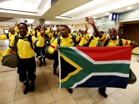 South African firefighters sing and dance as they arrive at the Edmonton International Airport on Thursday, June 15, 2023. The 213 firefighters will be fighting Alberta wildfires near Fox Creek and the High Level/Whitecourt areas. An earlier group of 214 firefighters from South African are already fighting wildfires in the Edson area.
