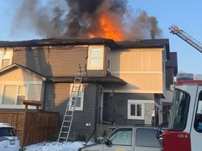 Calgary firefighters tackle a blaze in Saddle Ridge on Wednesday, July 5, 2023.