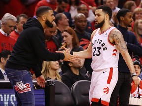 Fred VanVleet #23 of the Toronto Raptors high fives rapper Drake during game four of the NBA Eastern Conference Finals between the Milwaukee Bucks and the Toronto Raptors at Scotiabank Arena on May 21, 2019 in Toronto.