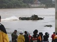 A South Korean Marine's assault amphibious vehicle is mobilized to search for missing people in the Sam River in Yecheon, South Korea, Tuesday, July 18, 2023. Rescuers continued their searches Tuesday for people still missing in landslides and other incidents caused by more than a week of torrential rains.