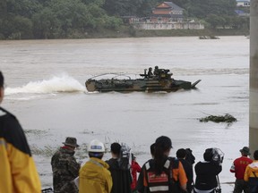 A South Korean Marine's assault amphibious vehicle is mobilized to search for missing people in the Sam River in Yecheon, South Korea, Tuesday, July 18, 2023. Rescuers continued their searches Tuesday for people still missing in landslides and other incidents caused by more than a week of torrential rains.