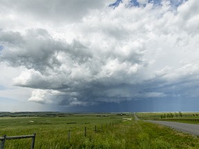 FILE PHOTO: A massive storm is seen passing over Calgary, as seen from a rural road east of Okotoks, Alta., on Wednesday, July 22, 2015. The storm came with a tornado warning.