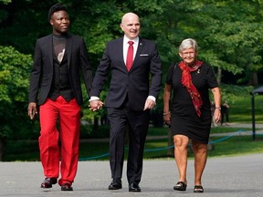 Randy Boissonnault, centre, arrives for a cabinet swearing-in ceremony at Rideau Hall in Ottawa on Wednesday, July 26, 2023.