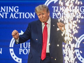 Former U.S. president and 2024 presidential hopeful Donald Trump gestures after speaking at the Turning Point Action USA conference in West Palm Beach, Fla., on July 15, 2023.