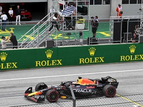 Red Bull Racing's Max Verstappen crosses the finish line to win the Austrian Grand Prix at the Red Bull race track in Spielberg, Austria on July 2, 2023.