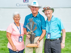 Ken Duke poses for a photo with his old friends Lorraine and Ken Oliphant from Lacombe after winning the Shaw Charity Classic at Canyon Meadows golf and country club on Sunday,
