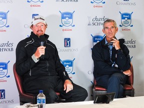 CALGARY, CANADA - AUGUST 18: Tim Petrovic (L) of the United States, who finished the day on the top of the leaderboard at -8, answers questions during an interview on day one of the Shaw Charity Classic at Canyon Meadows Golf & Country Club .