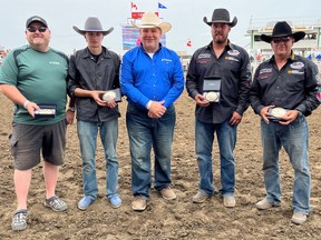 Mike Hira (from left), outrider Jory Bronken, Strathmore town councillor Richard Wegener, outrider Chance Flad and driver Ross Knight.