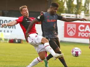 Cavalry FC Daan Klomp (P) battles Forge FC Manjrekar James during CPL soccer action between Cavalry FC and Forge FC at ATCO Field at Spruce Meadows in Calgary on Friday
