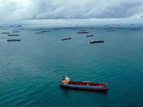 Aerial view of cargo ships waiting at the entrance of the Panama Canal at Panama Bay off Panama City, on August 23, 2023.