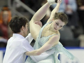 Alexandra Paul and Mitchell Islam, of Canada, skate their free dance at Skate Canada International in Kingston, Ont., on October 31, 2010. GEOFF ROBINS/AFP via Getty Images)