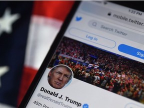 In this file photo illustration taken on August 10, 2020, the Twitter account of US President Donald Trump is displayed on a mobile phone in Arlington, Virginia.