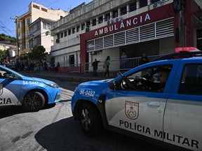 Vehicles of the Rio de Janeiro's Military Police are parked outside the Getulio Vargas hospital in Rio de Janeiro, Brazil on August 2, 2023