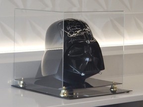 A photo of the stolen Darth Vader helmet signed by the original Star Wars cast, which Calgary police said is arguably the highest-value item that was stolen. Handout/Calgary Police Service