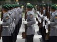 FILE - Soldiers of the honor guard prepare for a military welcome ceremony as part of a meeting of German Defence Minister Ursula von der Leyen and her counterpart from Great Britain Michael Fallon, in Berlin, Germany, Tuesday, Aug. 12, 2014. The German defense ministry says that it has received 178 applications for compensation by gay servicepeople who experienced discrimination in the military before a change of policy more than 20 years ago.