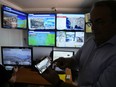 Grigoris Konstantellos, a commercial airline pilot and mayor of the southern Athens seaside suburbs of Vari, Voula and Vouliagmeni, shows on his cellphone the application of a drone warning system, at the control room in Voula, Athens, Greece, Thursday, Aug. 17, 2023. Greece is plagued by hundreds of wildfires each summer. To protect their area from potentially deadly blazes, a group of residents from a suburb in northern Athens have joined forces to hire a company using long-range drones equipped with thermal imaging cameras and a sophisticated early warning system to catch fires before they can spread.