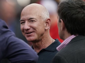 FILE - Amazon founder Jeff Bezos is seen on the sidelines before the start of an NFL football game, Sept. 15, 2022, in Kansas City, Mo. The founder of Amazon is buying a home on an exclusive barrier island in Miami where he'll be neighbors with Tom Brady, Ivanka Trump and her husband, Jared Kushner.