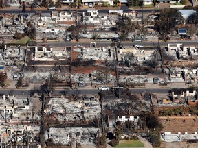 In an aerial view, homes and businesses are seen that were destroyed by a wildfire on Aug. 11, 2023 in Lahaina, Hawaii.