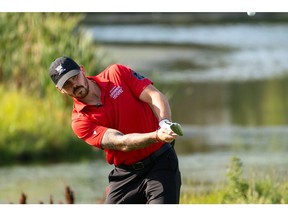 Calgary Flames defenceman Mackenzie Weegar takes a swing during the second round of the Shaw Charity Classic in Calgary,