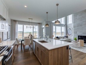 The kitchen in the Cambridge 26 show home by Trico Homes in the community of Chelsea.
