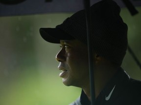 Tiger Woods watches on the 13th hole during the weather delayed third round of the Masters golf tournament at Augusta National Golf Club on April 8, 2023.