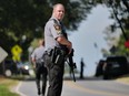 Police stand guard on the perimeter of a search zone for an escaped prisoner on September 08, 2023 in Kennett Square, Pennsylvania. Law officers, tactical teams, cops on horseback, tracking dogs, and aircraft are all searching for Danelo Souza Cavalcante, a 34-year-old from Brazil, who escaped from the Chester County Prison on Aug. 31.