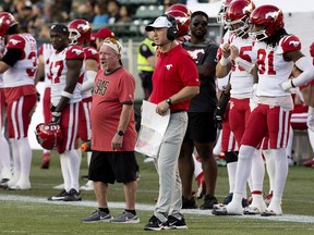 Calgary Stampeders' head coach Dave Dickenson (centre) during second half CFL action against the Edmonton Elks at Commonwealth Stadium, in Edmonton on Saturday, Sept. 9, 2023. The Elks won 25 to 22.
