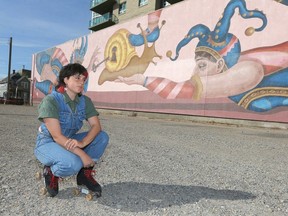 Artist Kayla Buium poses in front of a mural called Pandora's Snail near Macleod Trail and 15 Avenue SE in Calgary Monday, September 11, 2023. The mural is 3,500 square-feet and is a collaboration with BUMP and Cirque du Soleil and CMLC. Jim Wells/Postmedia