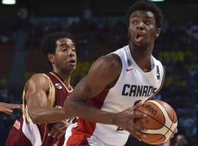 Venezuela's point guard Gregory Vargas (L) and teammate John Cox (C) mark Canada's shooting guard Andrew Wiggins (R) during their 2015 FIBA Americas Championship.