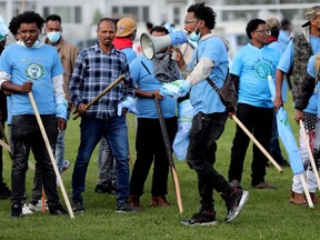 A riot between anti-Eritrean government protestors (pictured in blue) and pro-government Eritrean supporters broke out during a soccer tournament promoting world peace at the Rosslyn Park in Edmonton, Saturday Aug. 19, 2023.