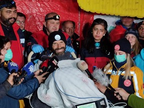 This handout photograph taken and released by Turkish news agency DHA (Demiroren News Agency) on Sept. 12, 2023, shows U.S. caver Mark Dickey, on a stretcher, is carried to an ambulance helicopter as his rescue operation comes to a successful end near Anamur in Mersin province, southern Turkey.