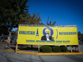 A photograph of late temple president Hardeep Singh Nijjar is seen on a banner outside the Guru Nanak Sikh Gurdwara Sahib, in Surrey, B.C., on Monday, September 18, 2023. A member of the Surrey, B.C., gurdwara where Sikh advocate Hardeep Singh Nijjar served as president before he was gunned down last June says police have also warned him about a threat to his life.