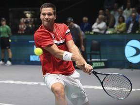 Canada's Alexis Galarneau in action against Italy's Lorenzo Sonego during their Davis Cup group stage match between Italy and Canada at the Unipol Arena in Bologna, Italy, Wednesday, Sept. 13, 2023.