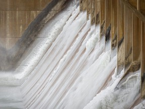 Waters of the Bow River flow through the gates of the Bassano Dam on Tuesday, February 18, 2020. The provincial government is studying the possibility of building a new dam 43 kilometres downstream.